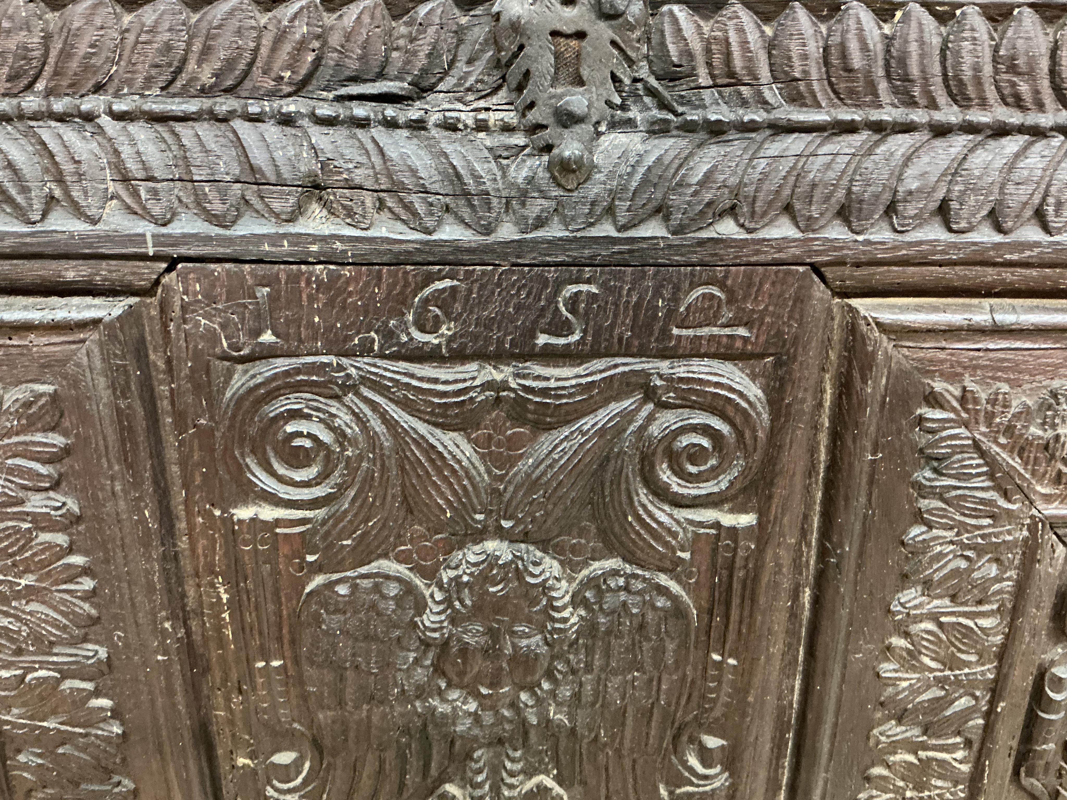 A 17th century carved oak panel, width 126cm, height 86cm